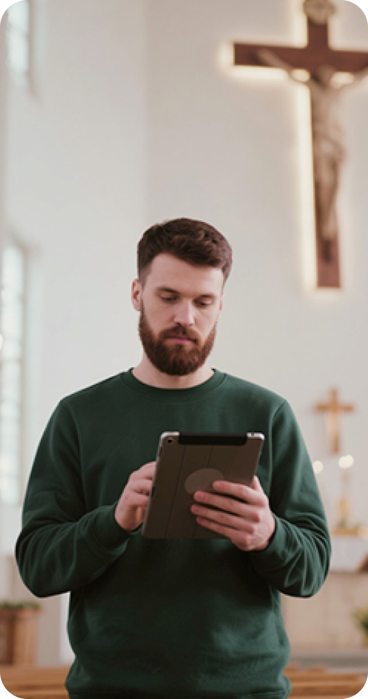 A church volunteer holding a tablet